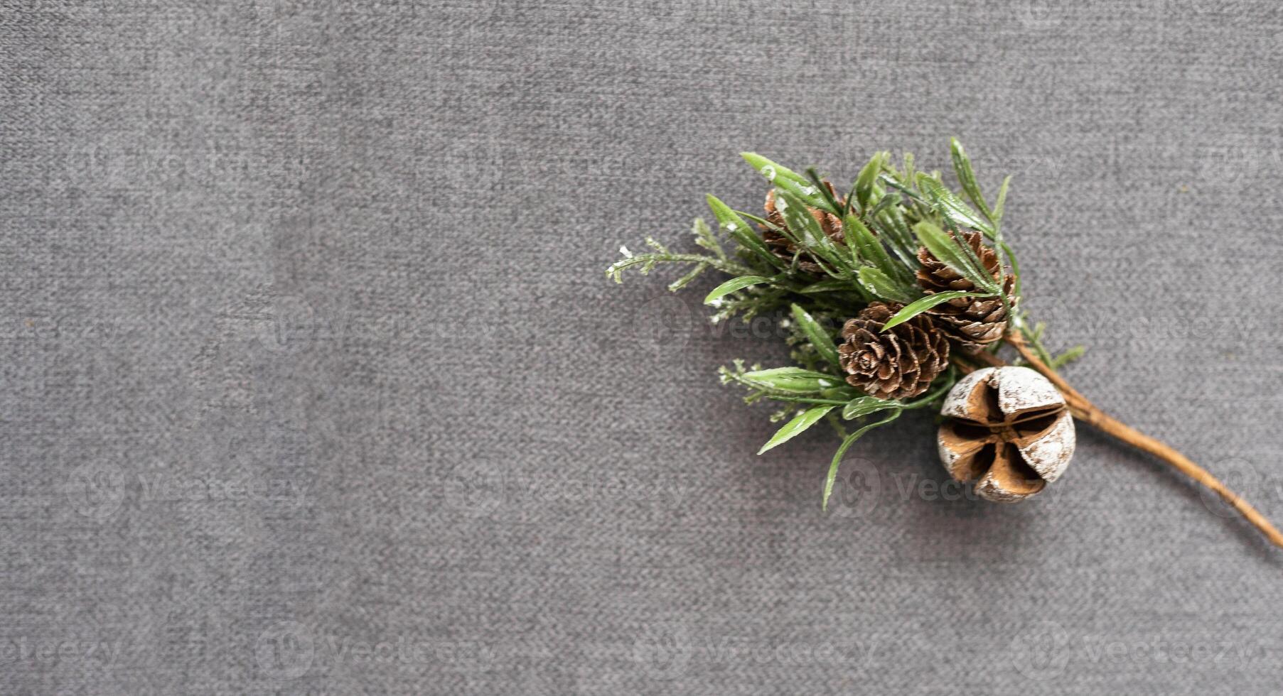 New Year background. Golden pine cones, fir branch, Christmas ball on white background. Top view, space for text. photo