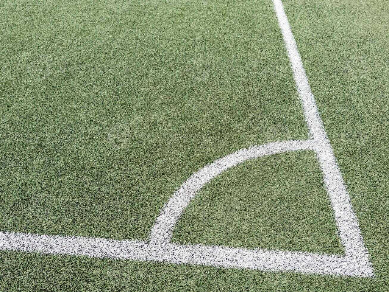 football field corner with artificial turf photo