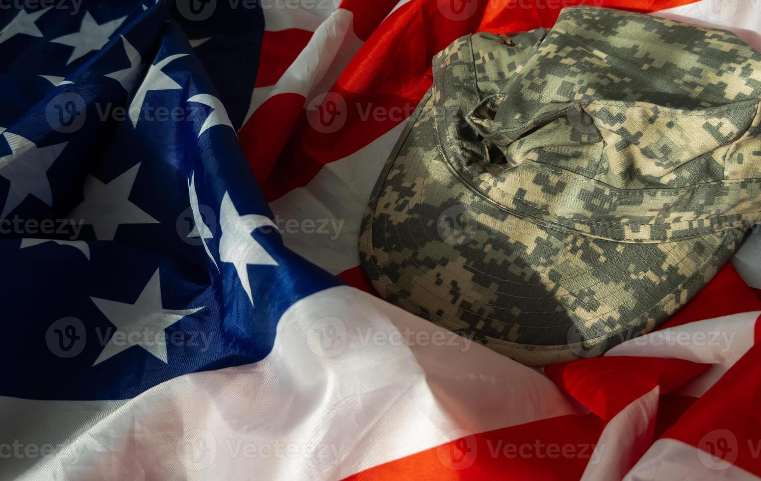US Army helmet and dog tag on US flag background photo