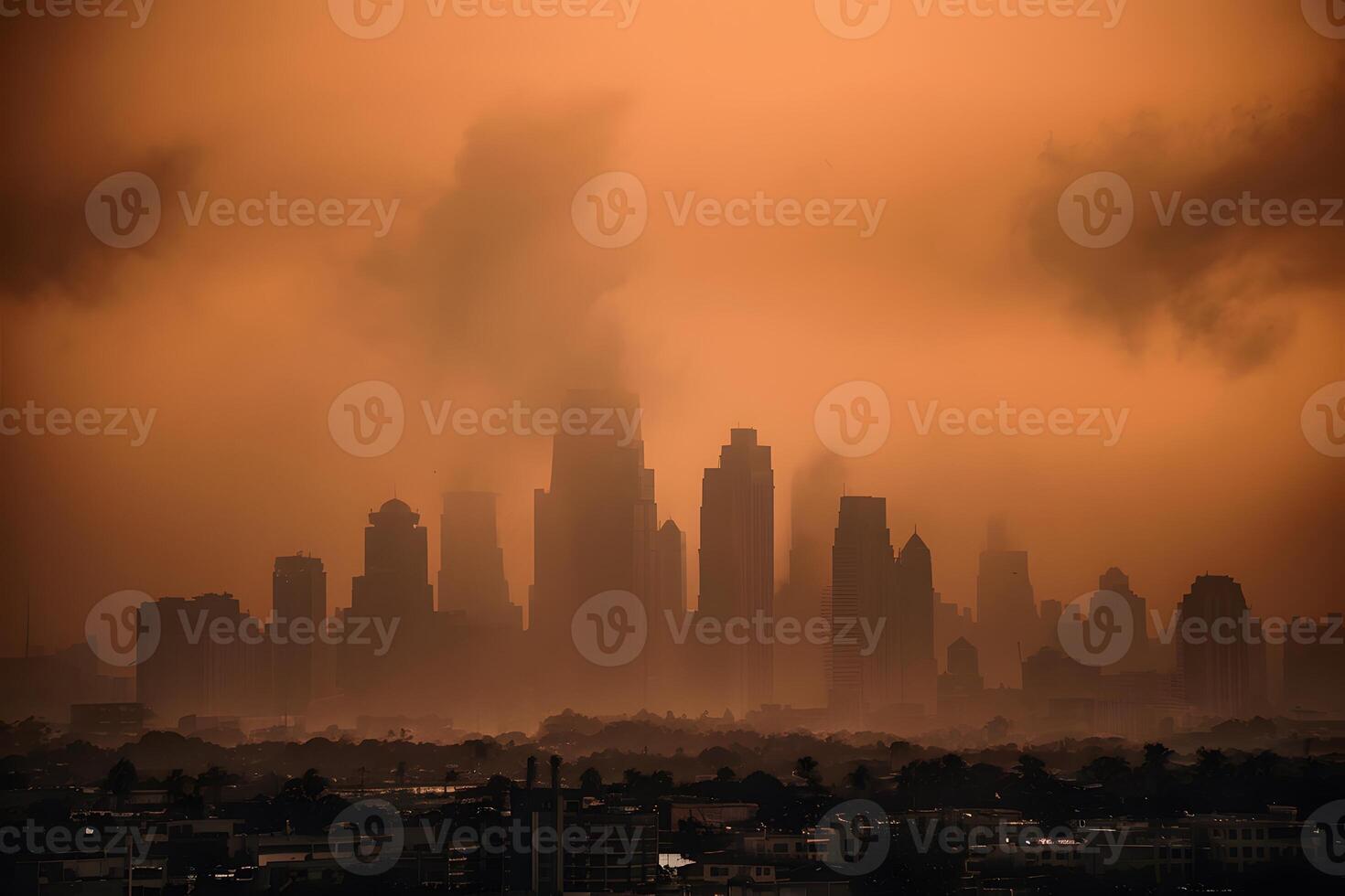 Hazy city skyline under orange sky conveys drama and mystery photo