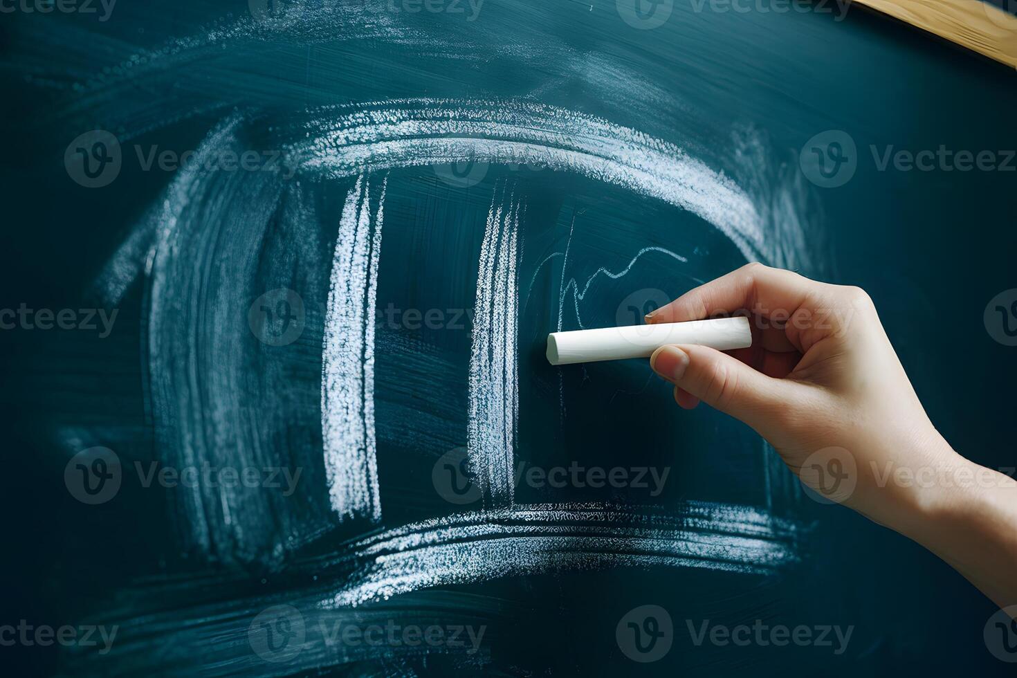 Chalkboard ready for creativity, hand with chalk poised to draw or write photo