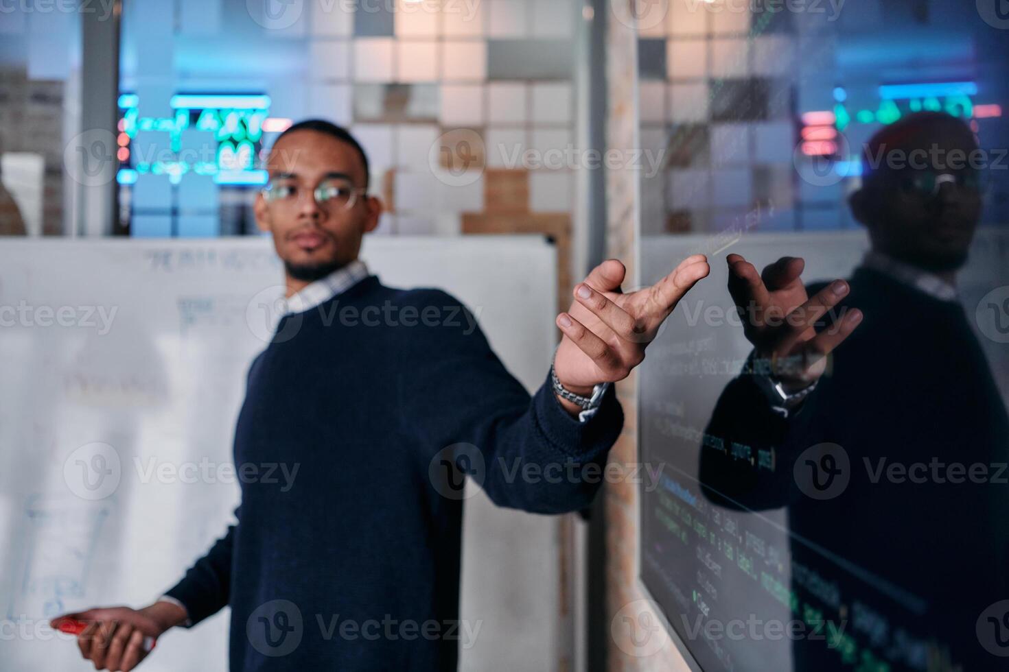 African American businessman delivers a compelling presentation of his business strategy to his colleagues, fostering collaboration and forward thinking photo