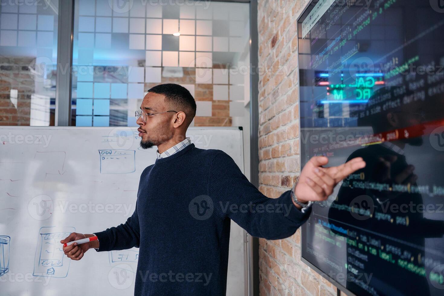 African American businessman delivers a compelling presentation of his business strategy to his colleagues, fostering collaboration and forward thinking photo