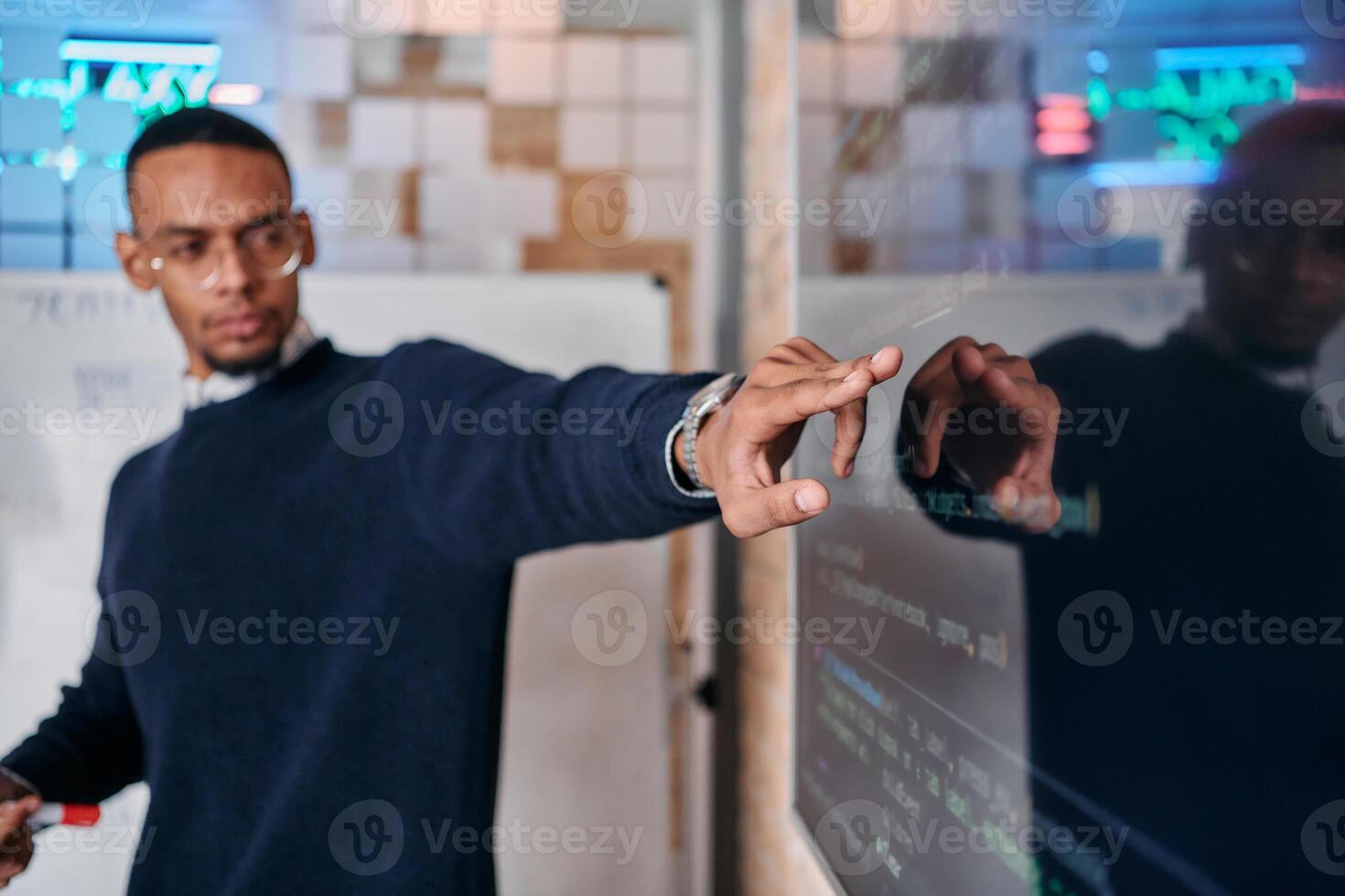 African American businessman delivers a compelling presentation of his business strategy to his colleagues, fostering collaboration and forward thinking photo