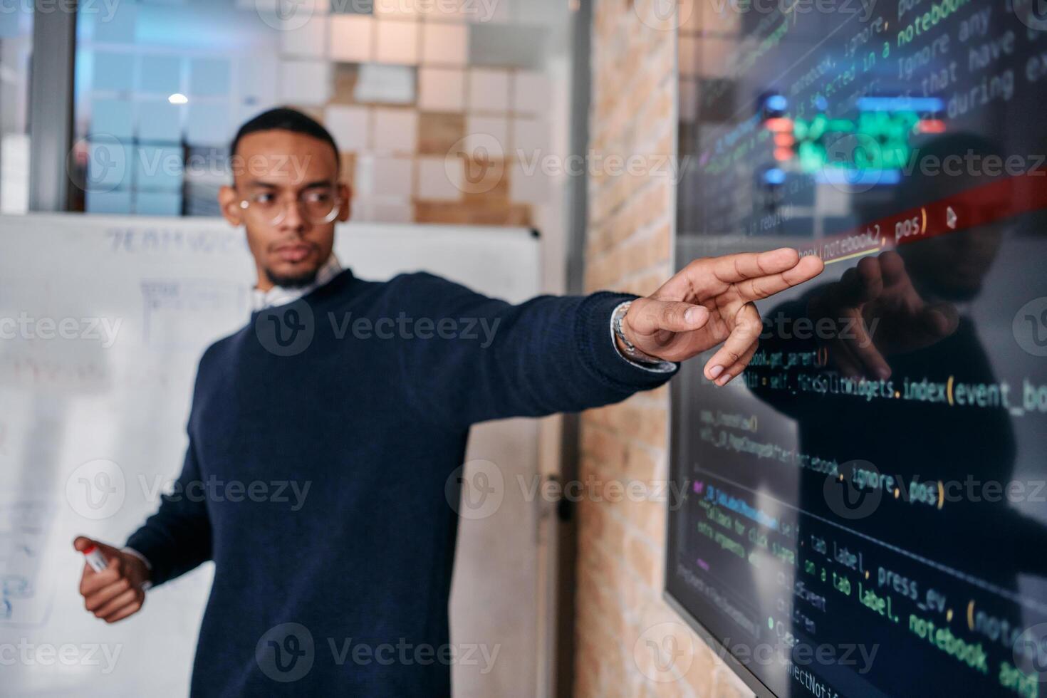 African American businessman delivers a compelling presentation of his business strategy to his colleagues, fostering collaboration and forward thinking photo