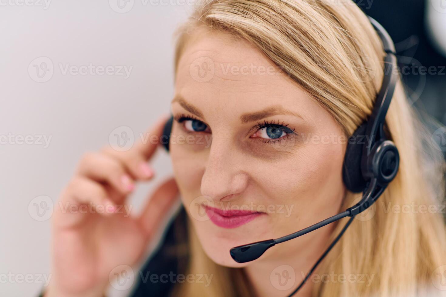 Friendly Call Center Agent Answering Incoming Calls with Headset Providing Remote Customer Service. photo