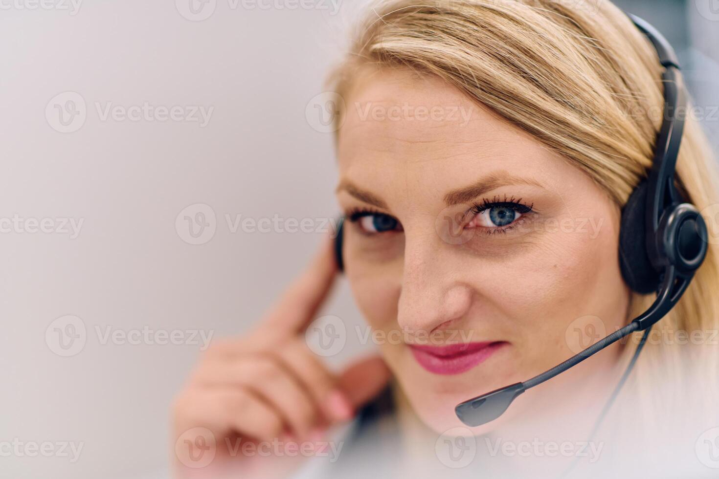 Friendly Call Center Agent Answering Incoming Calls with Headset Providing Remote Customer Service. photo