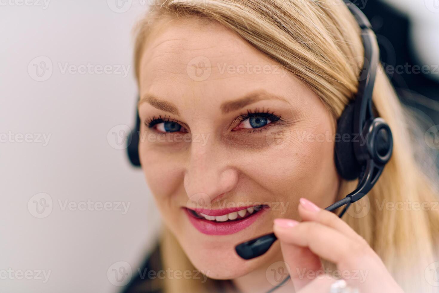 Friendly Call Center Agent Answering Incoming Calls with Headset Providing Remote Customer Service. photo