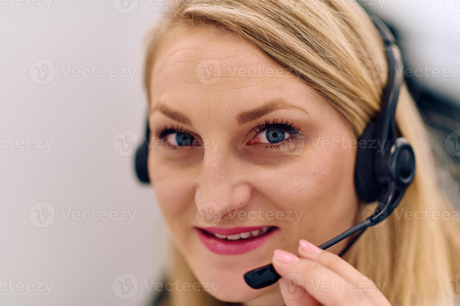 Friendly Call Center Agent Answering Incoming Calls with Headset Providing Remote Customer Service. photo