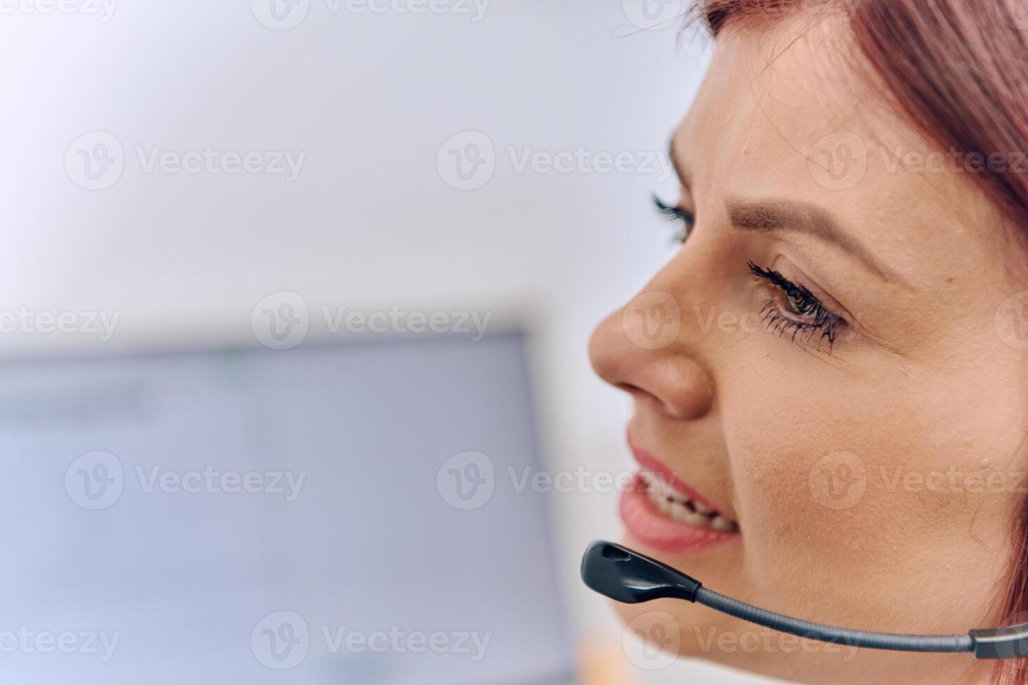 Friendly Call Center Agent Answering Incoming Calls with Headset Providing Remote Customer Service. photo