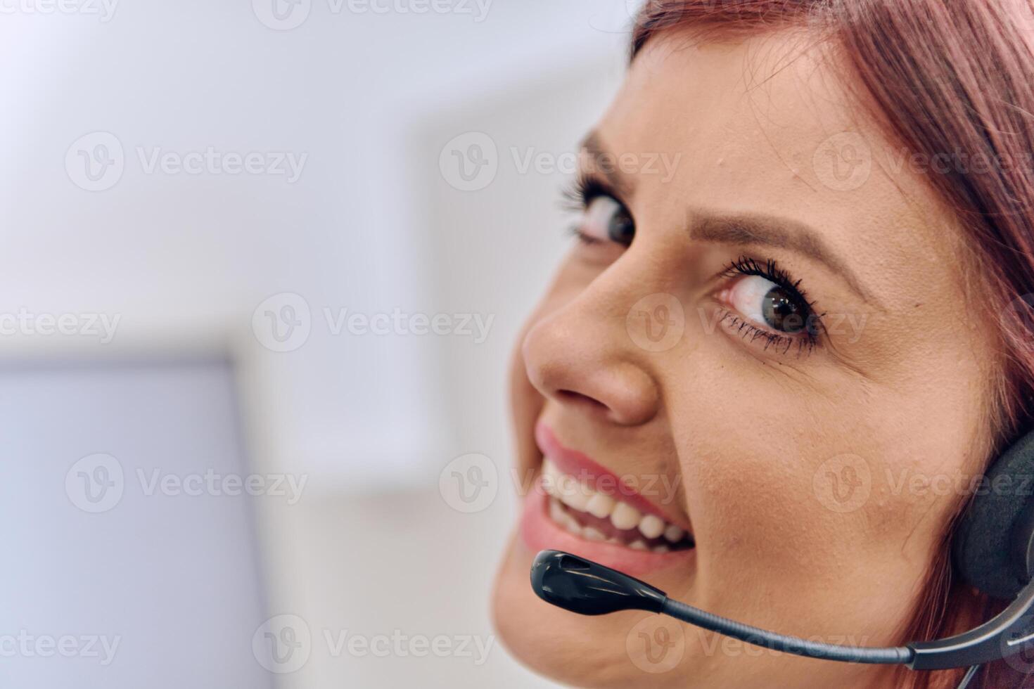 Friendly Call Center Agent Answering Incoming Calls with Headset Providing Remote Customer Service. photo