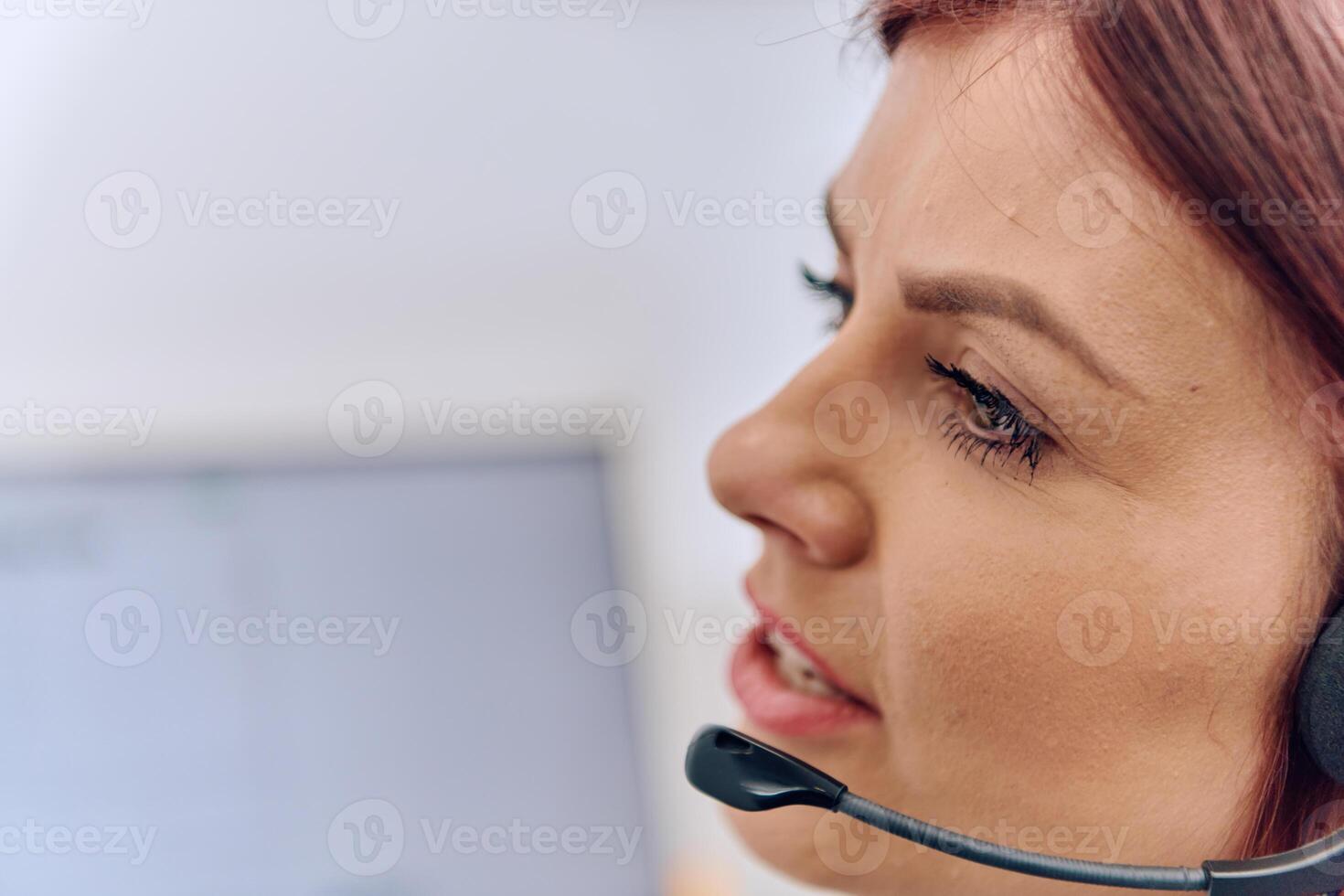 Friendly Call Center Agent Answering Incoming Calls with Headset Providing Remote Customer Service. photo