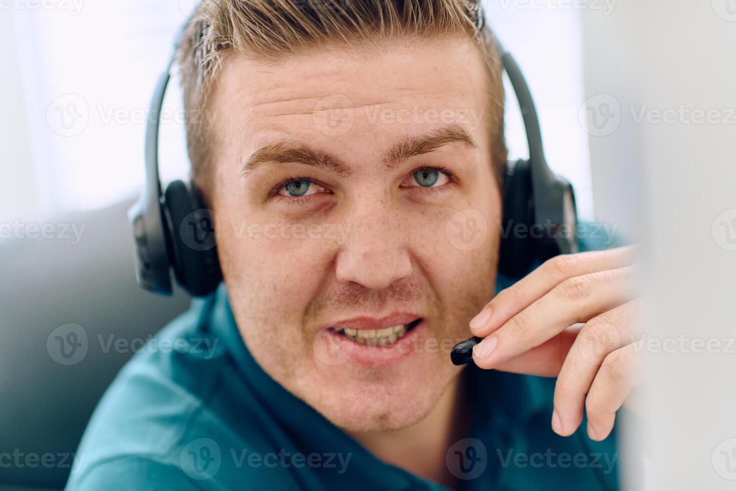 Close Up Portrait of a Customer Support Representative in a Call Center Environment. photo