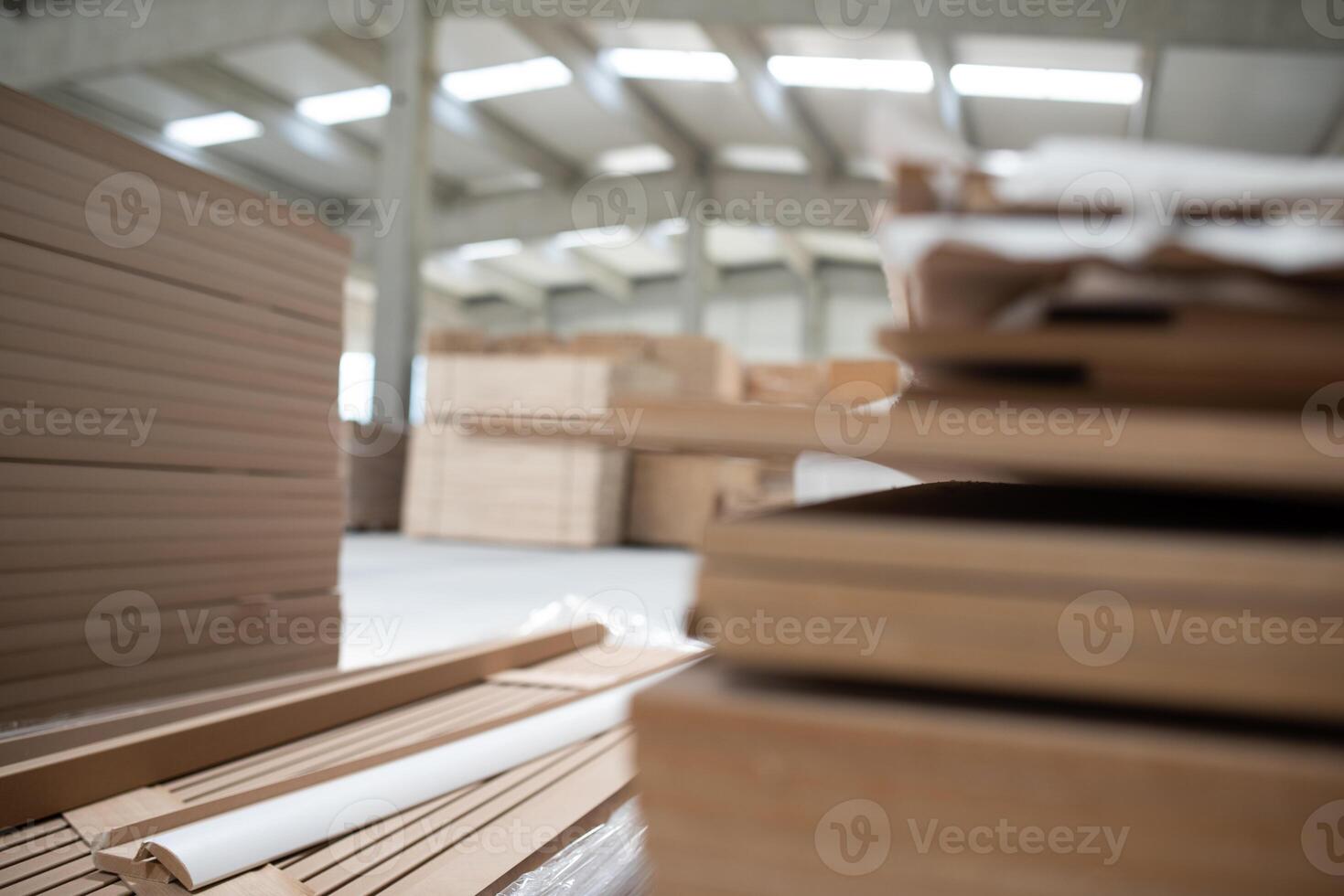 A vast warehouse in the forestry industry, showcasing a plethora of wooden products, including boards and various timber items neatly organized in storage photo