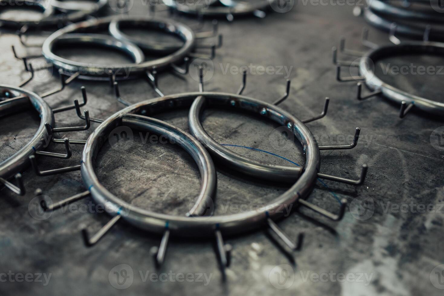 Pieces of steel lined up on the table ready for the welding process photo