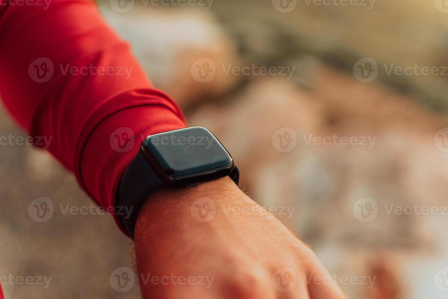 Man Using A Digital Smartwatch During Workout. Closeup View Of Man's Hands Checking An App In Smartwatch. Close-up Of A Clock That Shows Steps, Kilometers And bpm. photo