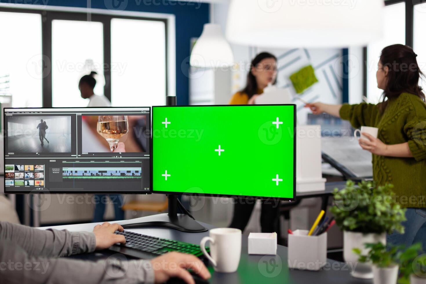 maker editing movie using post production software working in creative agency at pc with green screen, chroma key, mock up isolated display. Videographer processing audio film montage photo