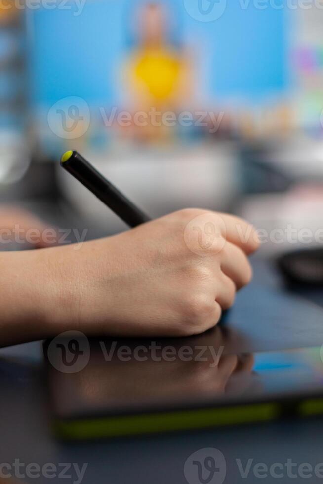 Close up of color designer freelancer photographer editing customer photo using computer with two displays and stylus pen. Graphic editor retouching assets drawing on graphic tablet in creative agency