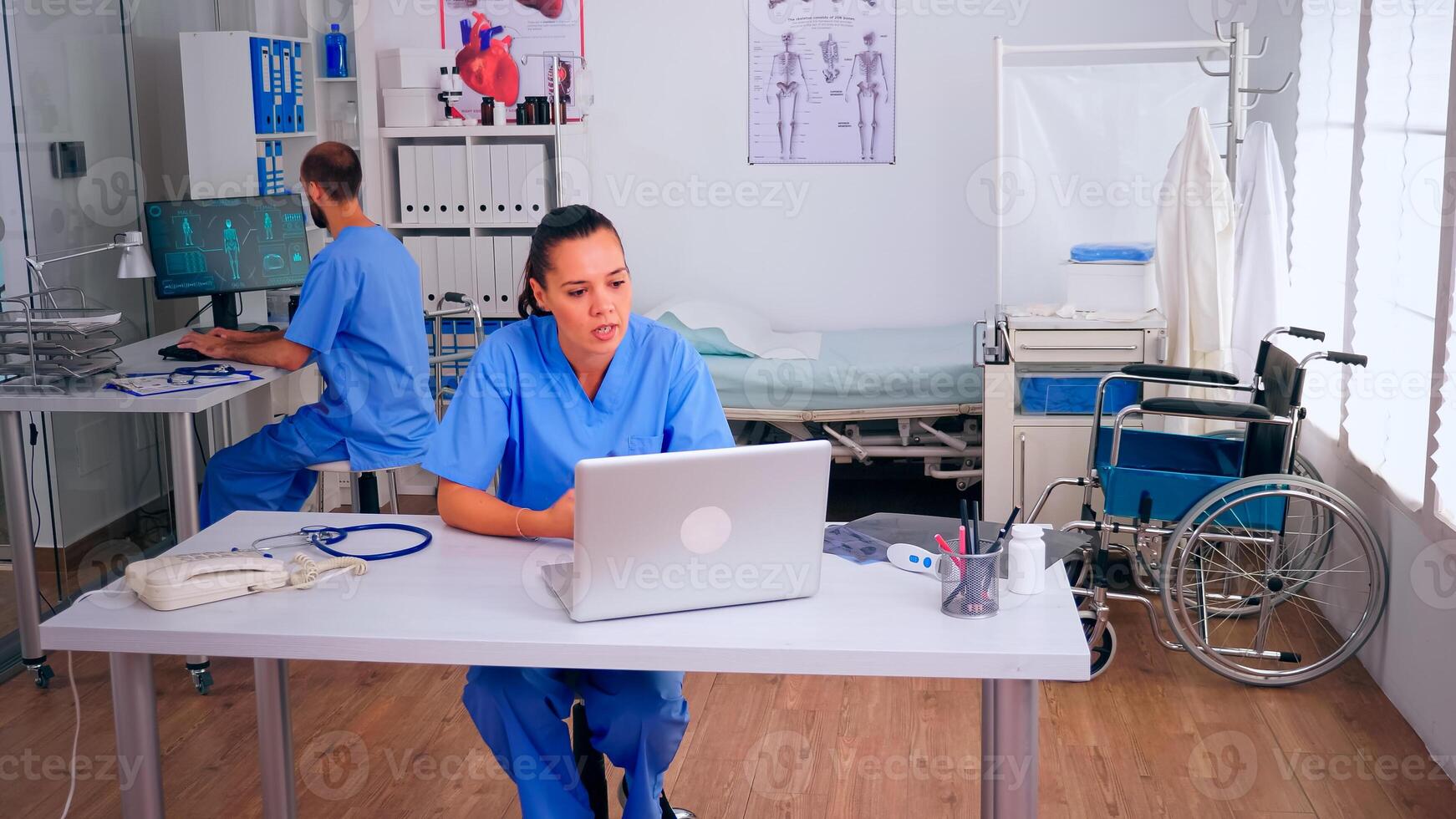Physician assistant offering medical online advice for patient diagnosis using laptop. Practitioner consulting person during virtual discussion meeting helping, telemedicine and healthcare support, photo