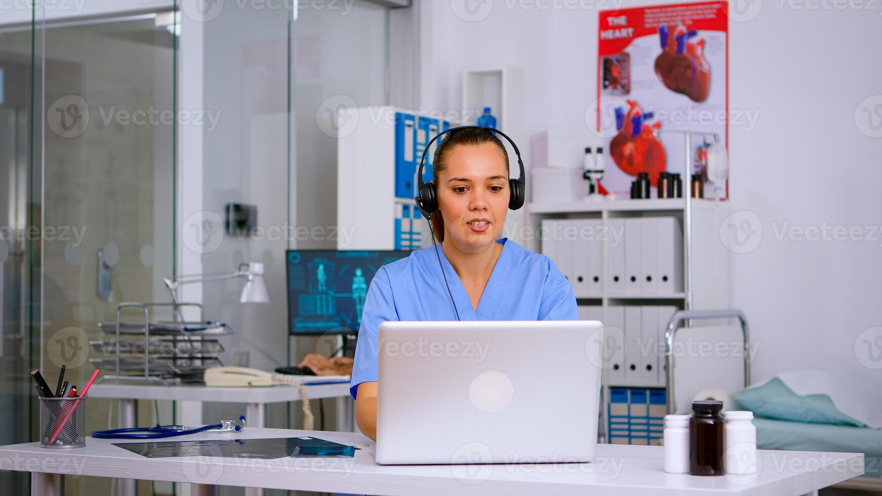Assistant offering medical services using headphone answering calls, making appointments. hospital call center Healthcare physician in medicine clinic, receptionist doctor nurse helping with concultation photo
