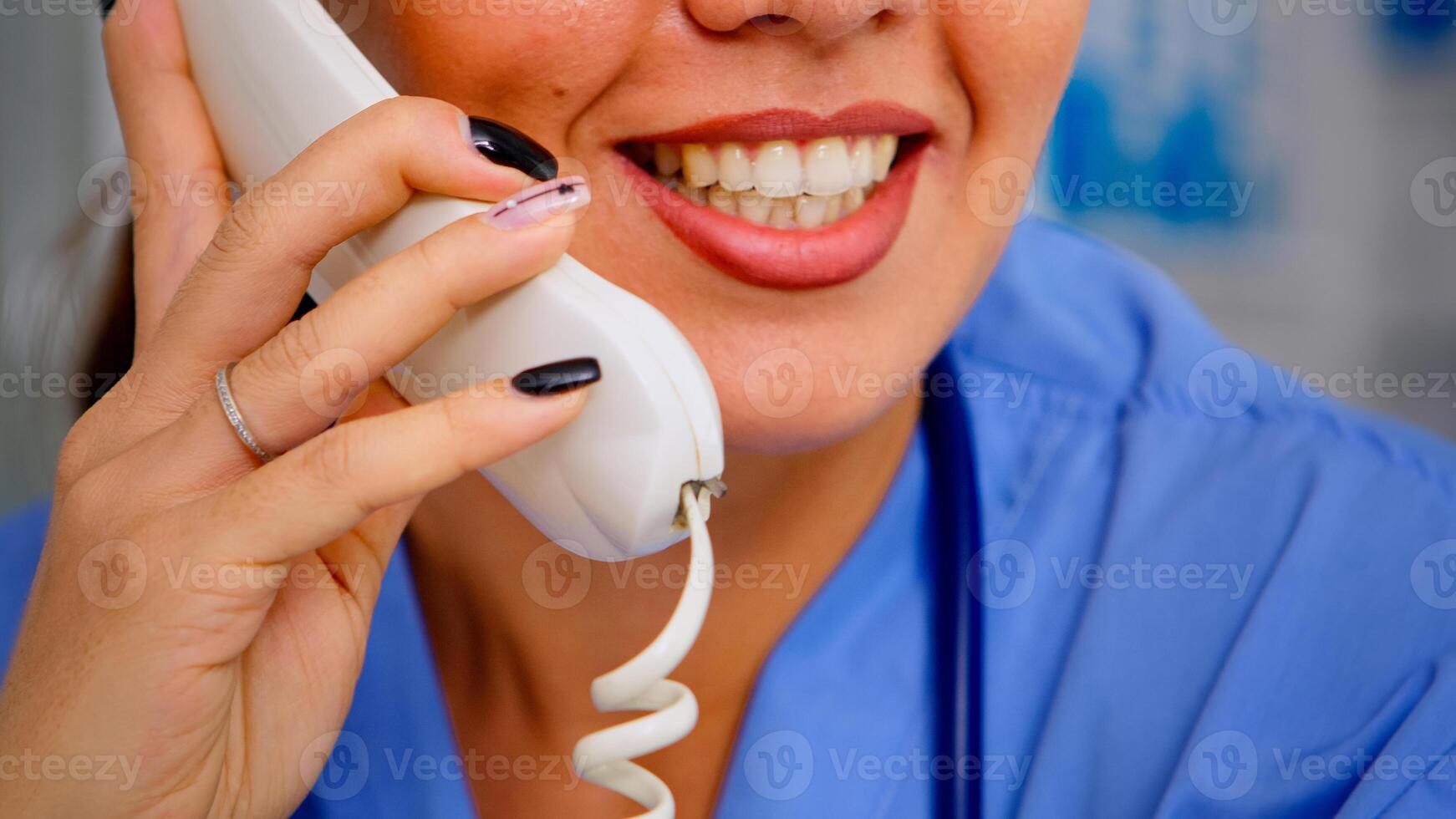 Close up of specialist practitioner talking at phone during telehealth communication, helping patient with mild health conditions. Healthcare physician in uniform, doctor assistant offering consultation photo
