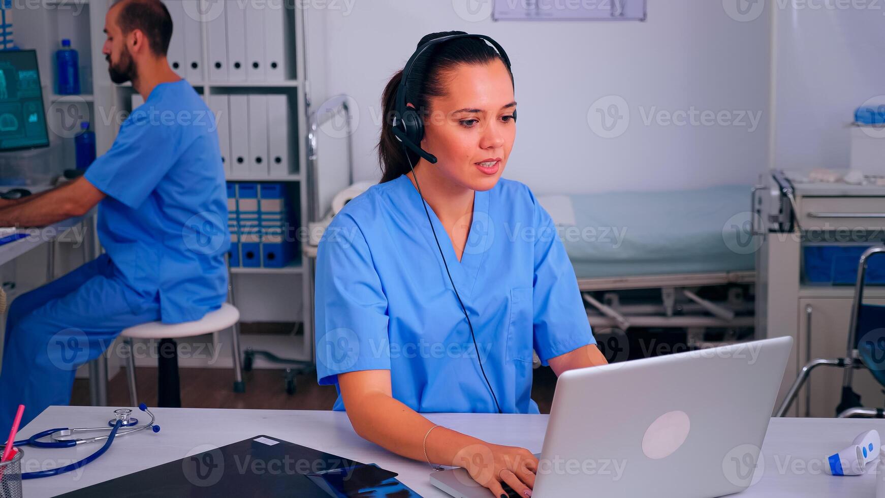 Assistant offering medical online services using headphone answering calls, making appointments. hospital call center Healthcare physician in medicine clinic, receptionist doctor nurse helping with concultation photo