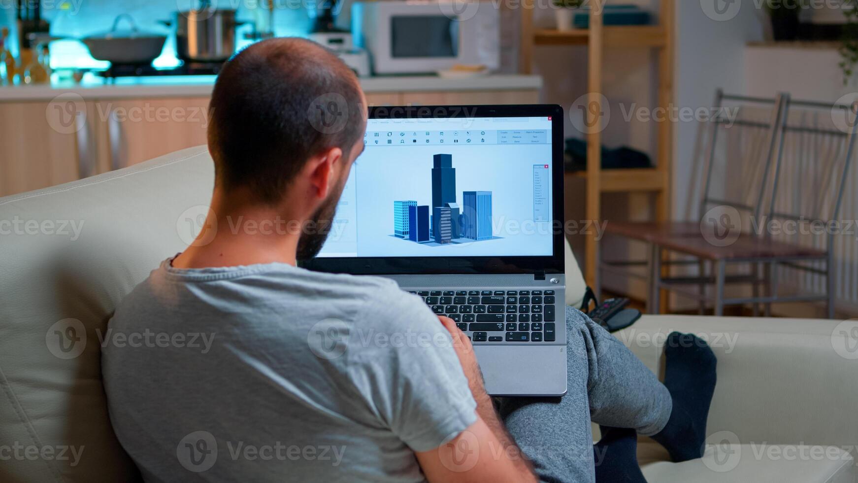 Architect using cad software to design industrial prototype drawing product shape working overtime from home. Tired freelancer looking at laptop computer display for new technical construction concept photo