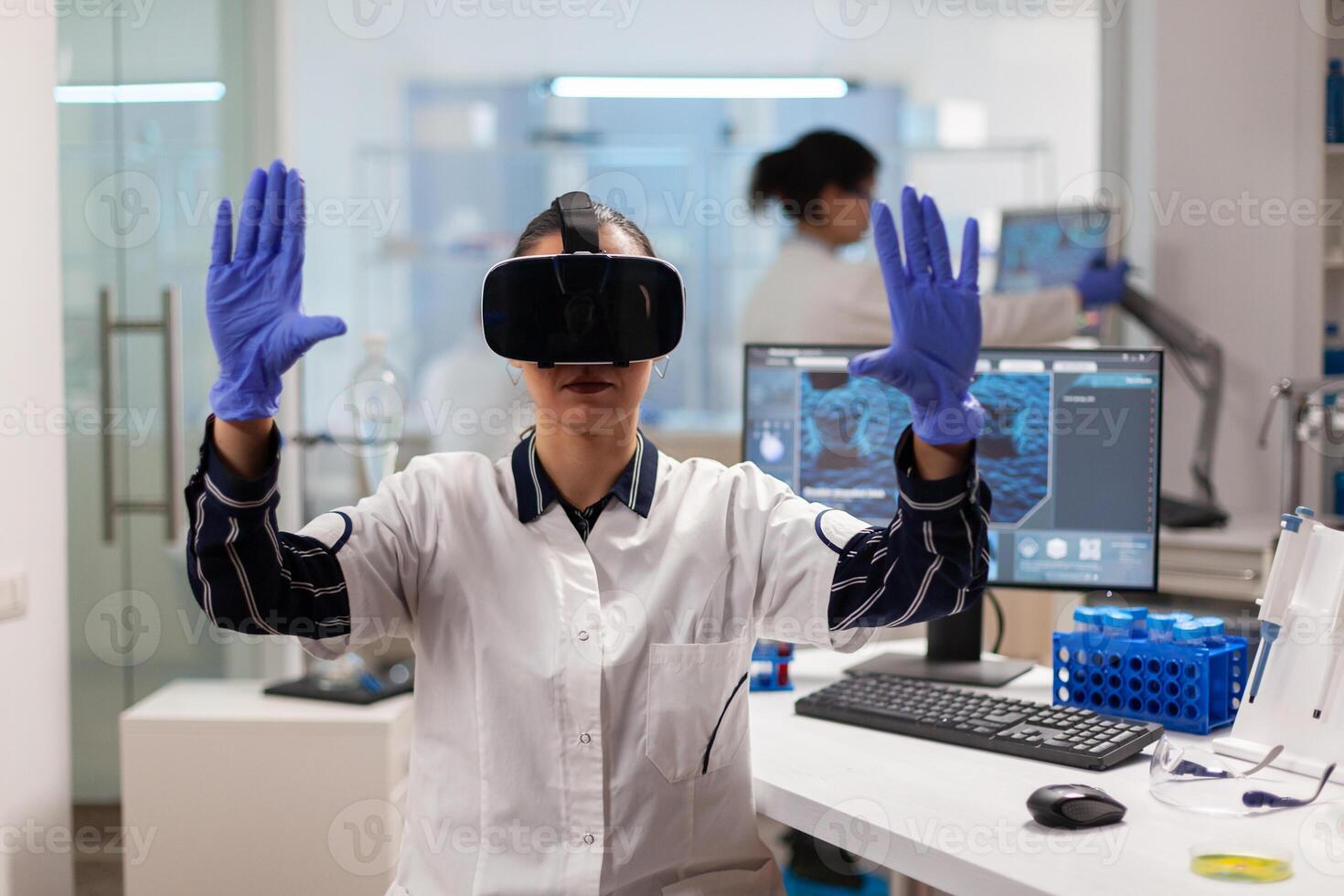 Biochemist doctor experiencing virtual reality wearing headset during vaccine experiment. Team of researchers working with equipment device, future, medicine, healthcare, professional, vision, simulator. photo