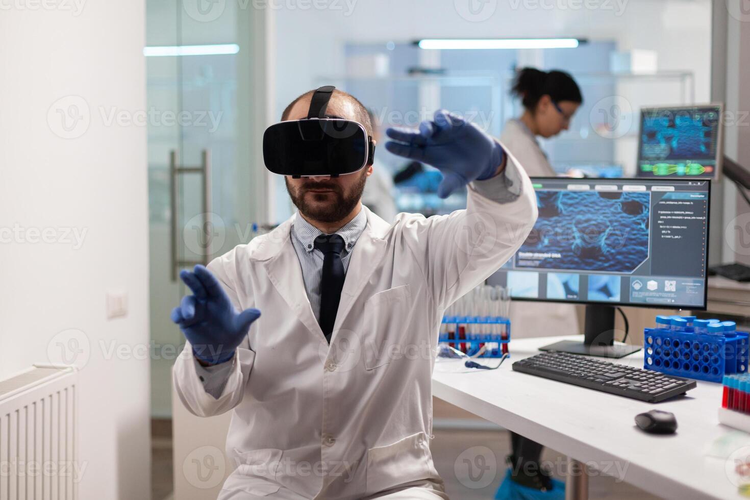 Medicine scientist doing virtual simulation of virus vaccine wearing vr headset. Team of researchers working with equipment device, future, medicine, healthcare, professional, vision, simulator. photo