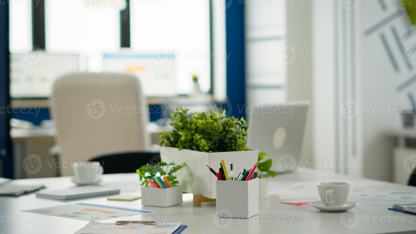 Interior of modern open plan financial office with no people, stylish room interior with meeting table and chairs. Business center with brainstorm area, shot of empty room with modern furniture. photo