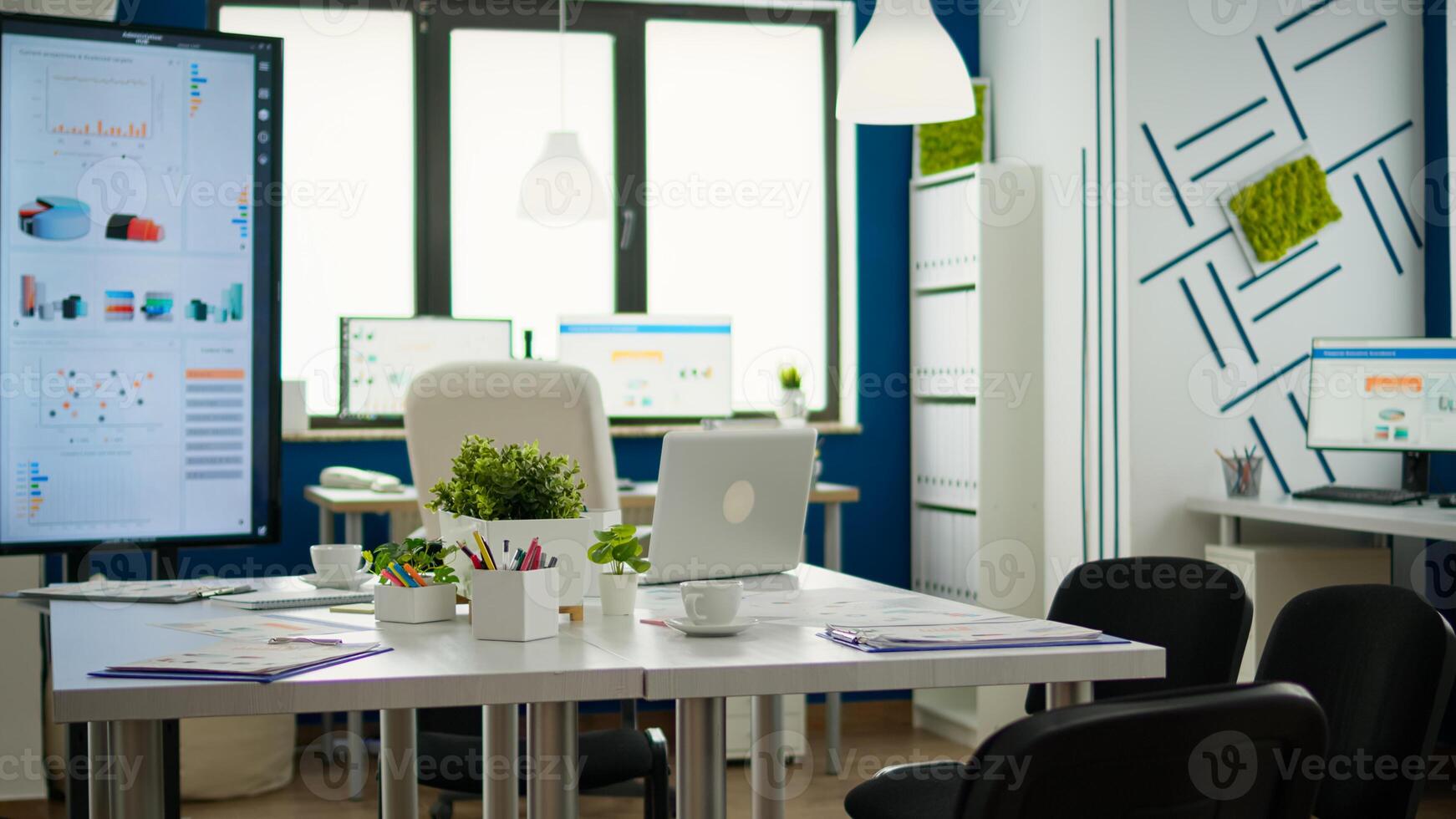 Empty start up business office, cozy light company room with conference table ready for brainstorming, modern design for meeting room. Financial company with nobody in it, workplace indoors concept. photo