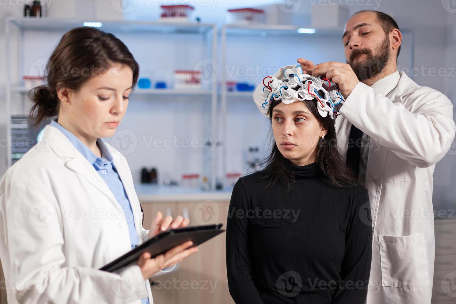 Team neurological doctors working together developing treatment for diagnosis of disease, explaning eeg results, health status, brain functions, nervous system and tomography scan. photo