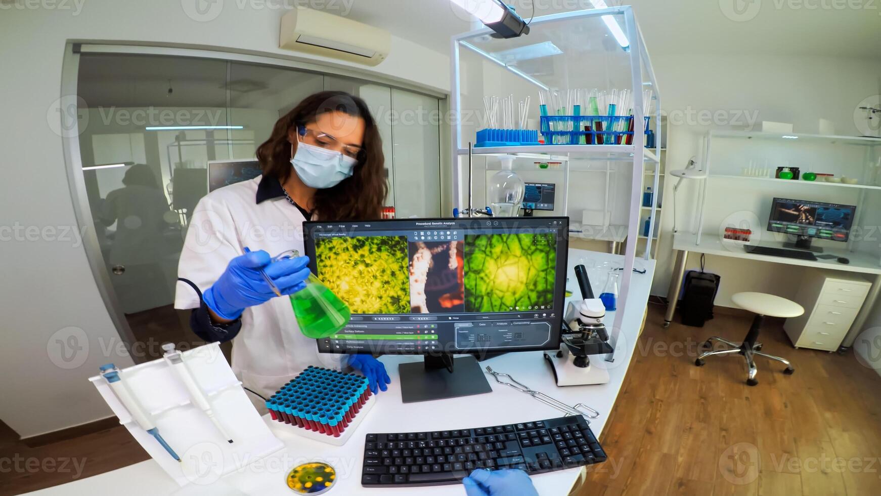 POV of laboratory medical stuff disscussing about vaccine development holding chemical container with green sample. Scientist working with DNA scan image in modern equipped laboratory using high tech photo