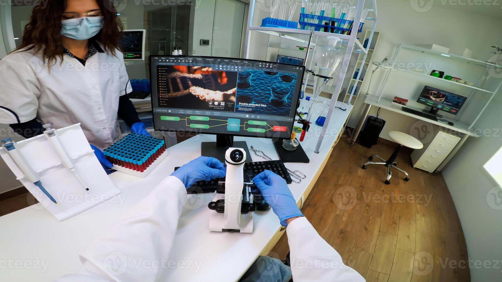 FPV of biotechnology scientist researching in laboratory using microscope analysing various bacteria. Chemist examining virus evolution using high tech for scientific research of vaccine development photo