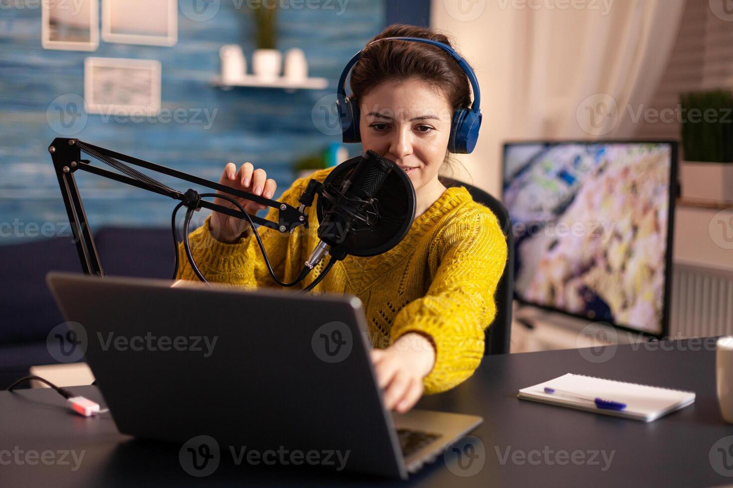 Blogger speaking with followers on live podcast using headphones. Creative online show On-air production internet broadcast host streaming live content, recording digital social media communication. photo