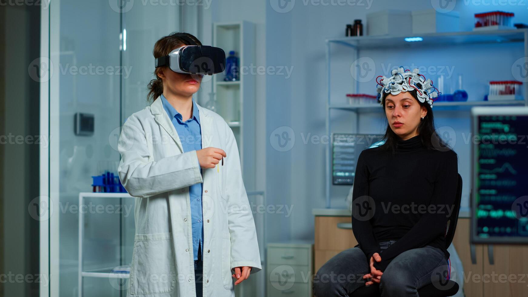 Professional researcher wearing virtual reality glasses using medical inovation in lab analysing brain scan of patient. Team of neurological doctors working with equipment high tech simulator device photo