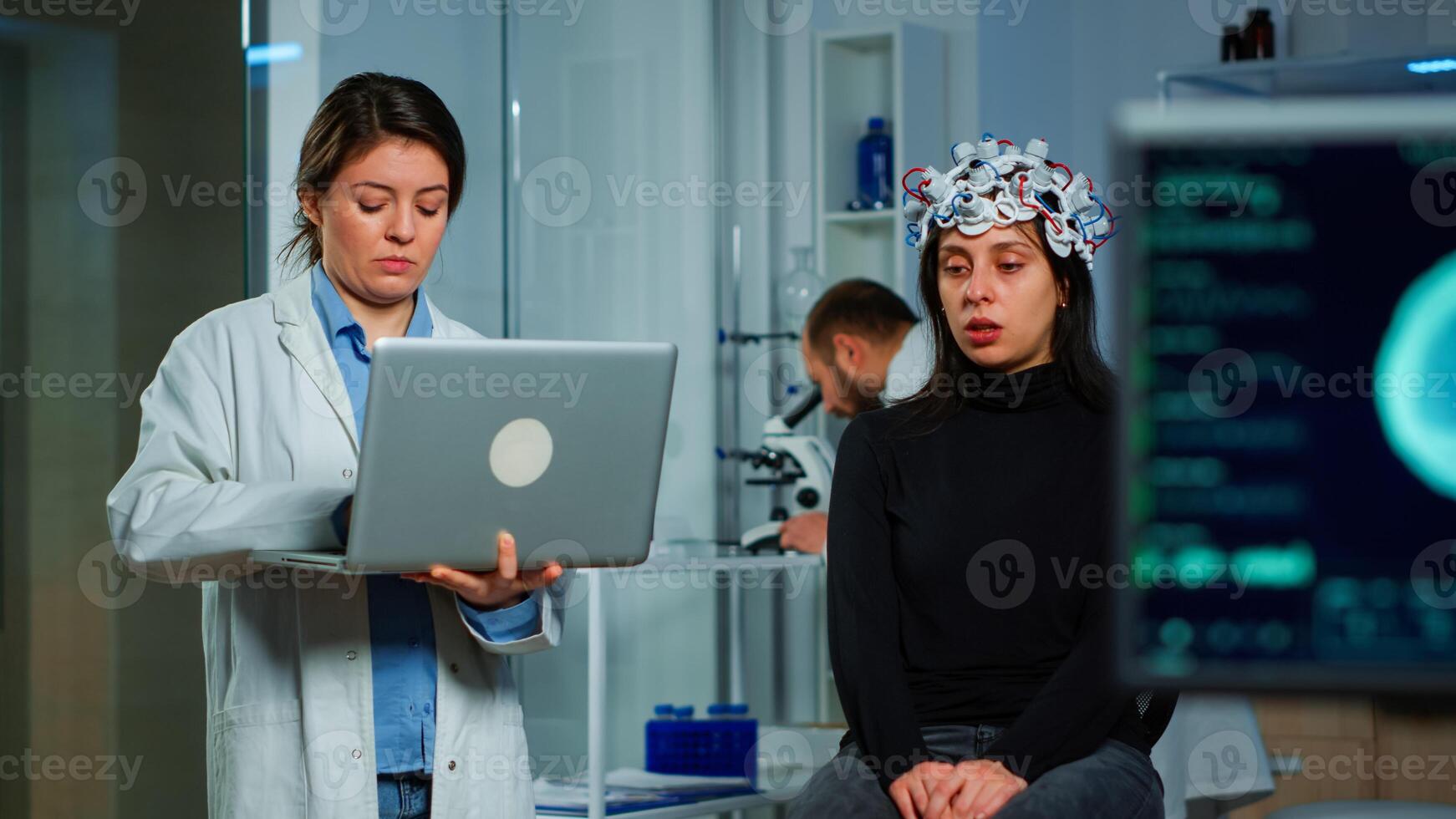 Team neurological doctors working together developing treatment for diagnosis of disease, explaning eeg results, health status, brain functions, nervous system and tomography scan. photo