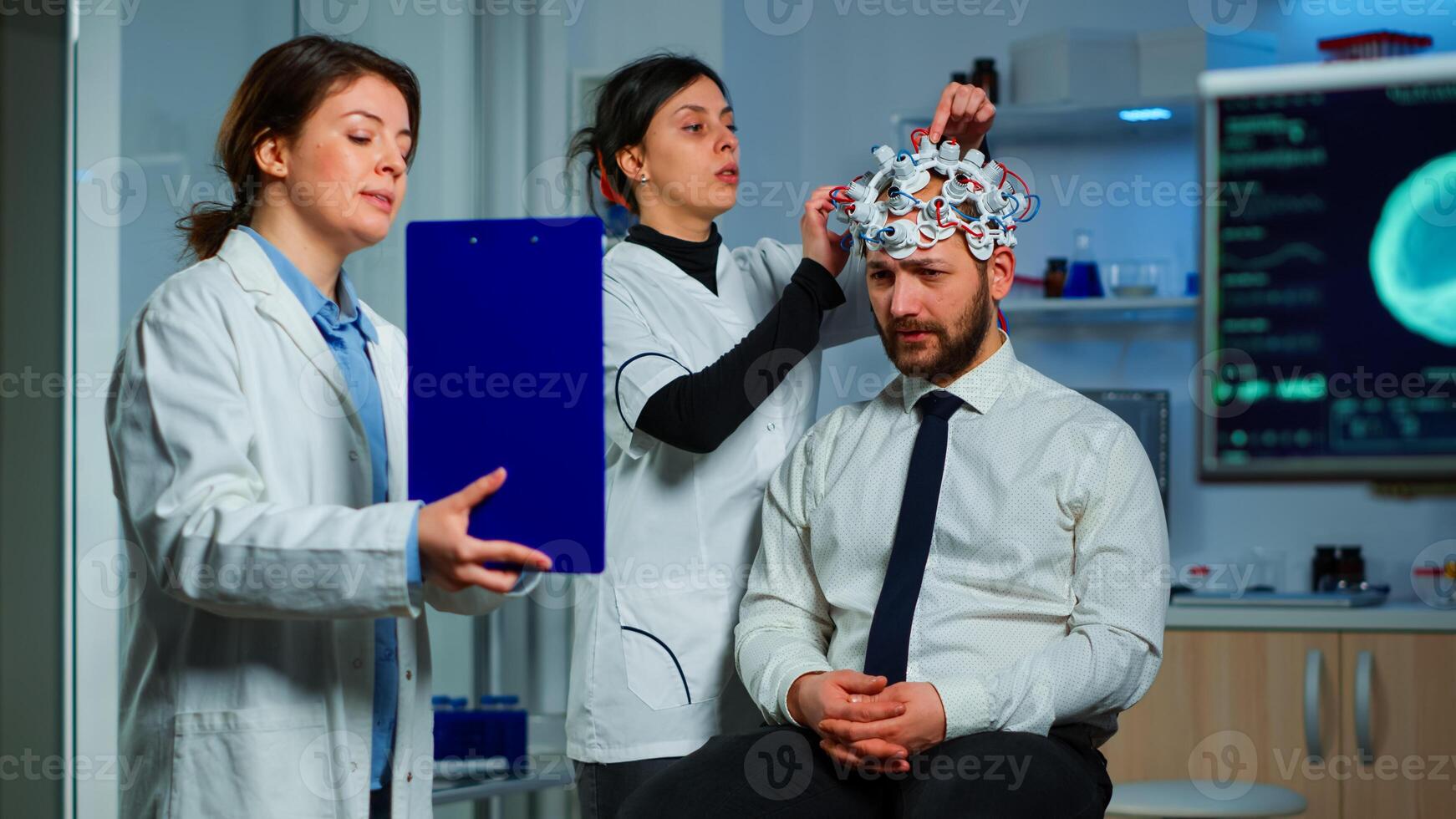 Neuroscience doctor showing on clipboard treatment against brain disease explaning to patient diagnosis of illness. Woman sitting in neurological scientific lab treating nervous system dysfunctions photo