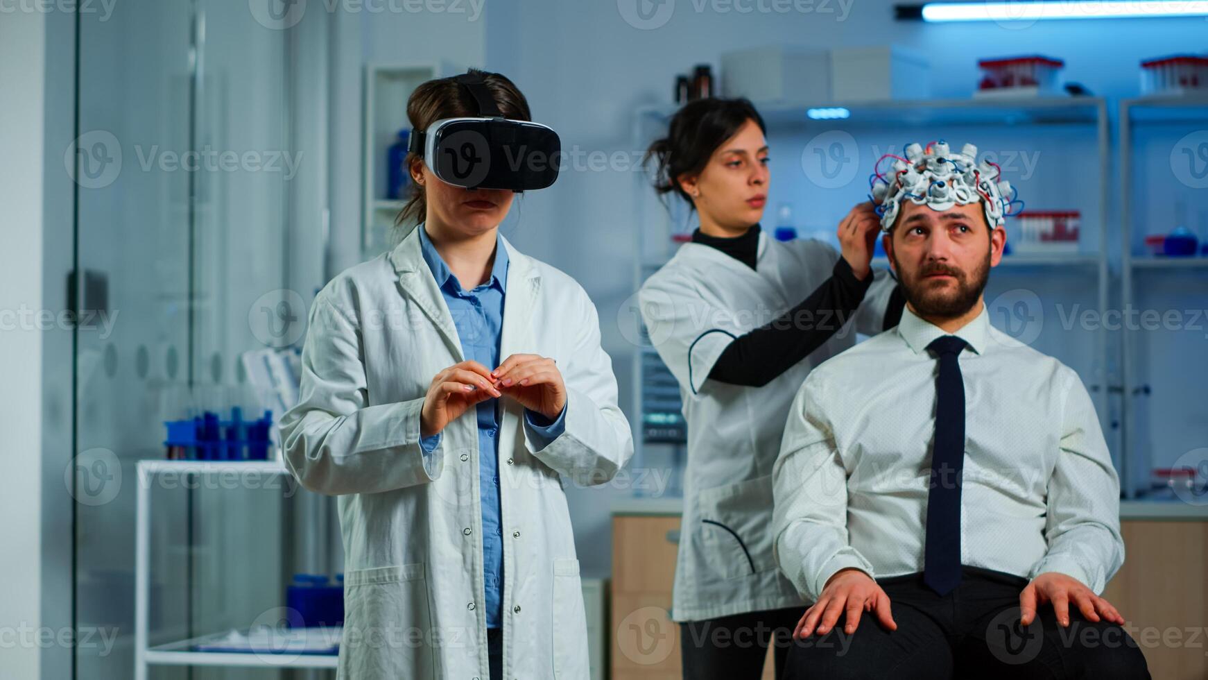 Advanced neurological scientist using medical inovation in lab wearing virtual reality glasses, gesticulating. Team of researchers working with equipment device, future, medicine, healthcare, vision, simulator photo