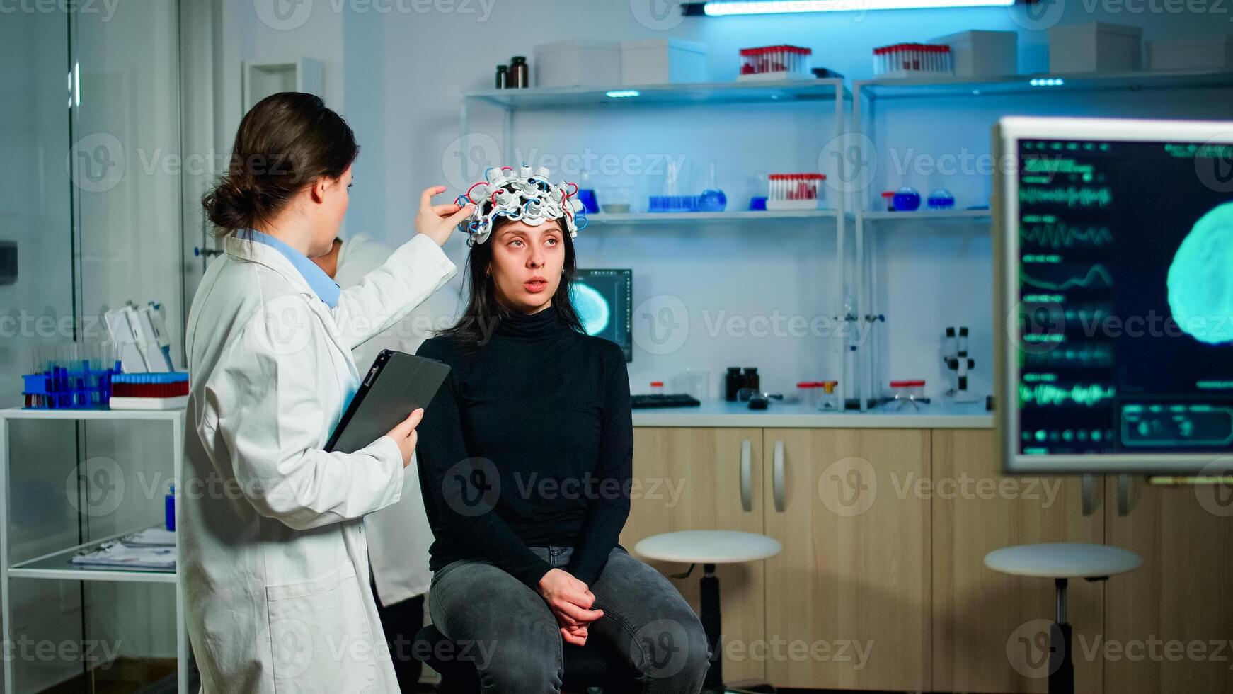 Doctor analysing brain scan using tablet, examining evolution of disease working in neurological laboratory. Monitoring nervous system functions using high tech in technologically advanced lab office photo