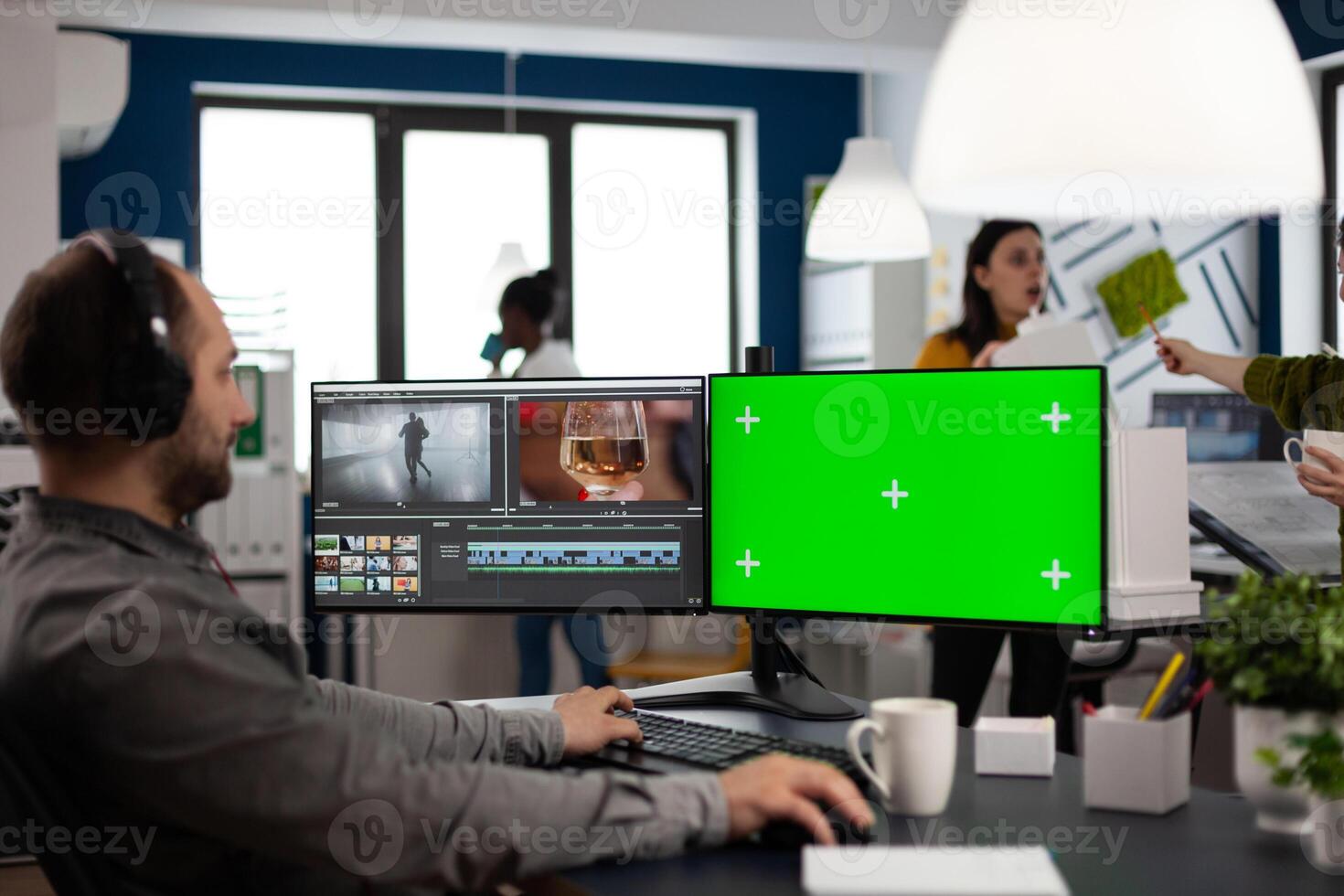 maker editor editing movie project using post production software working in post production agency at pc with green screen, chroma key, mock up isolated display. Man processing audio montage photo