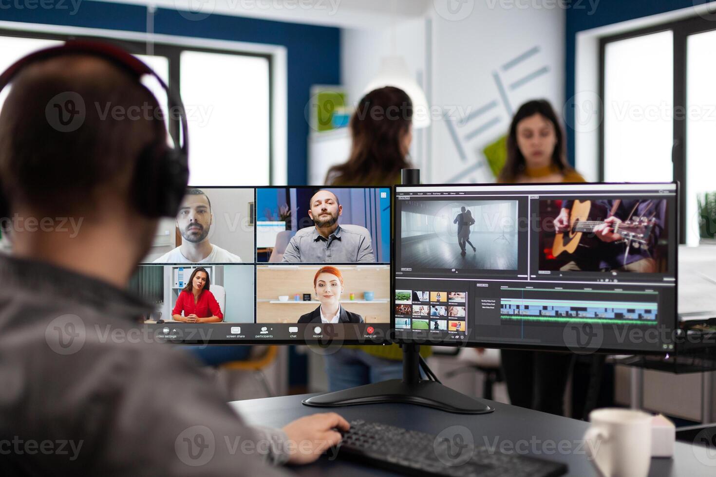 Project manager in web online meeting with team on call editing client creative montage, getting feedback on movie project using post production software on computer in start up office photo