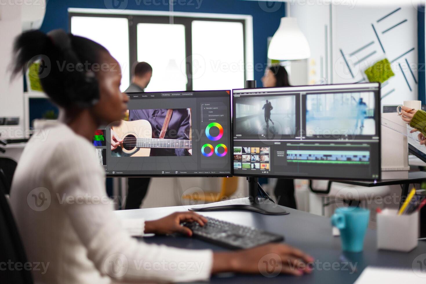 Black woman videographer developing project film montage sitting in creativity agency studio. editor creator in digital multimedia company editing movie with post production software photo