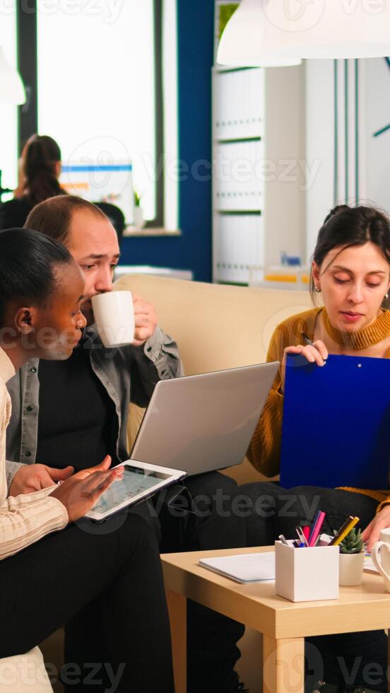 Multiethnic business team brainstorming on project during start up meeting, diverse employees group listening colleagues, sharing idea, discussing new marketing plan at professional group briefing photo