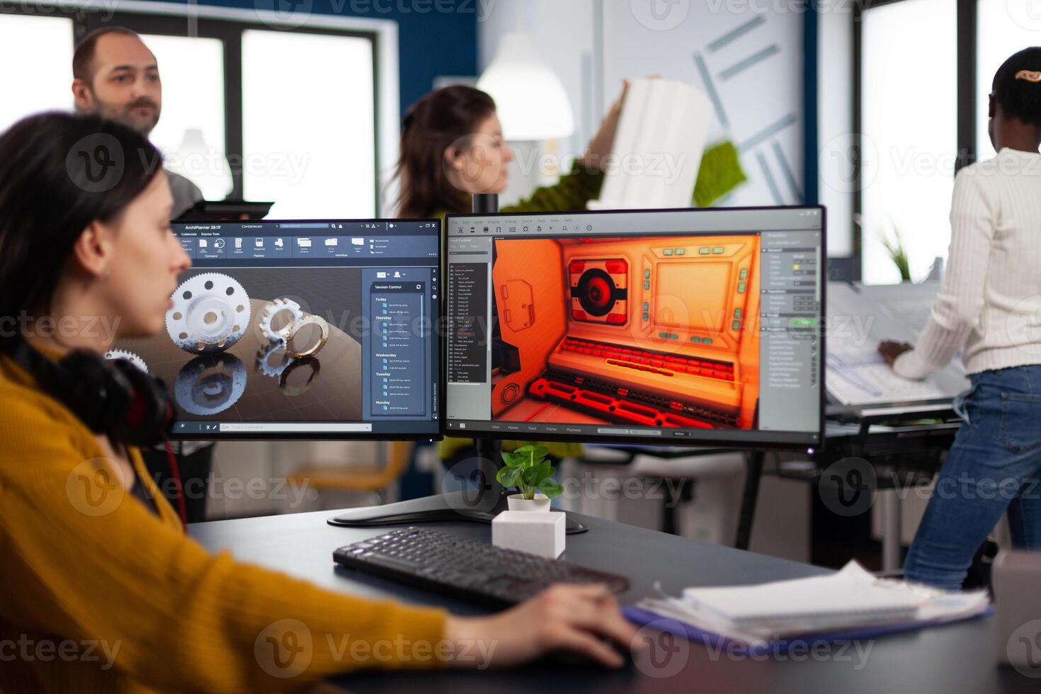 Engineer developer analyzing cad software to develop creative game, working in startup gaming company for prototype. Design technician studying on computer developing new online games photo