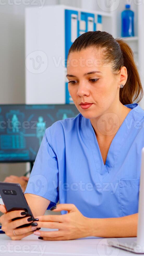 Medical nurse consulting patient online using smartphone, explaining treatment for disease. Therapist remote consultation in teleconference virtual mobile chat application, telehealth, helping concept photo
