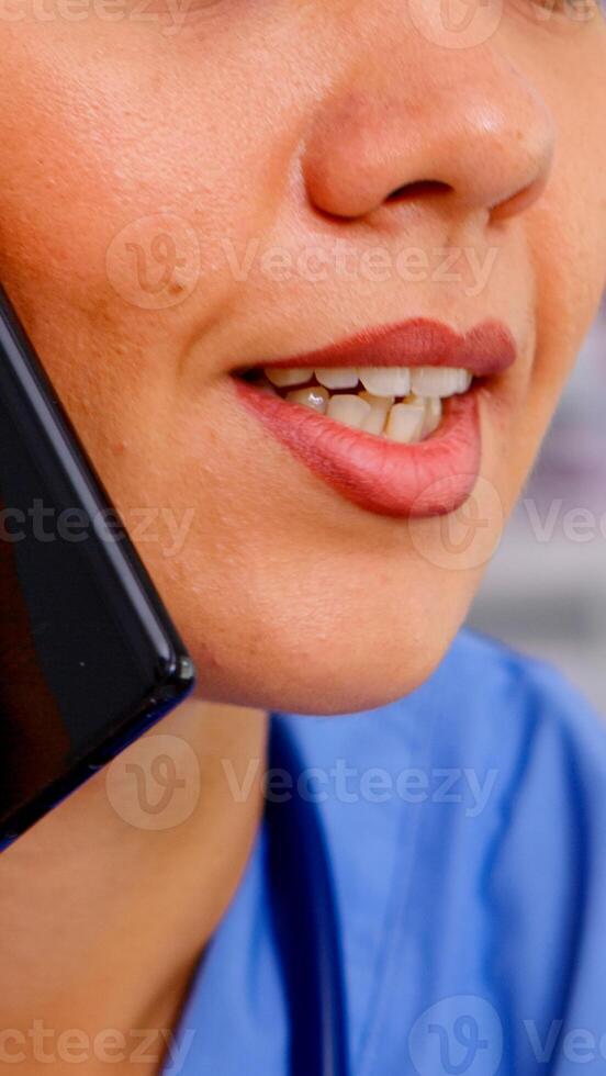 Healthcare physician consulting remote patients using phone in hospital wearing medicine uniform. Close up of doctor assistant helping patient with telehealth communication, diagnosing photo