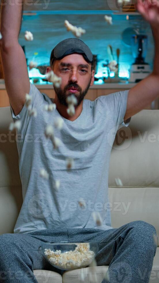 POV dissapointed upset angry man watching sport competition, favourite team loosing big championship. Soccer football fan expressing anger and frustration while watching TV. Slow motion shot photo