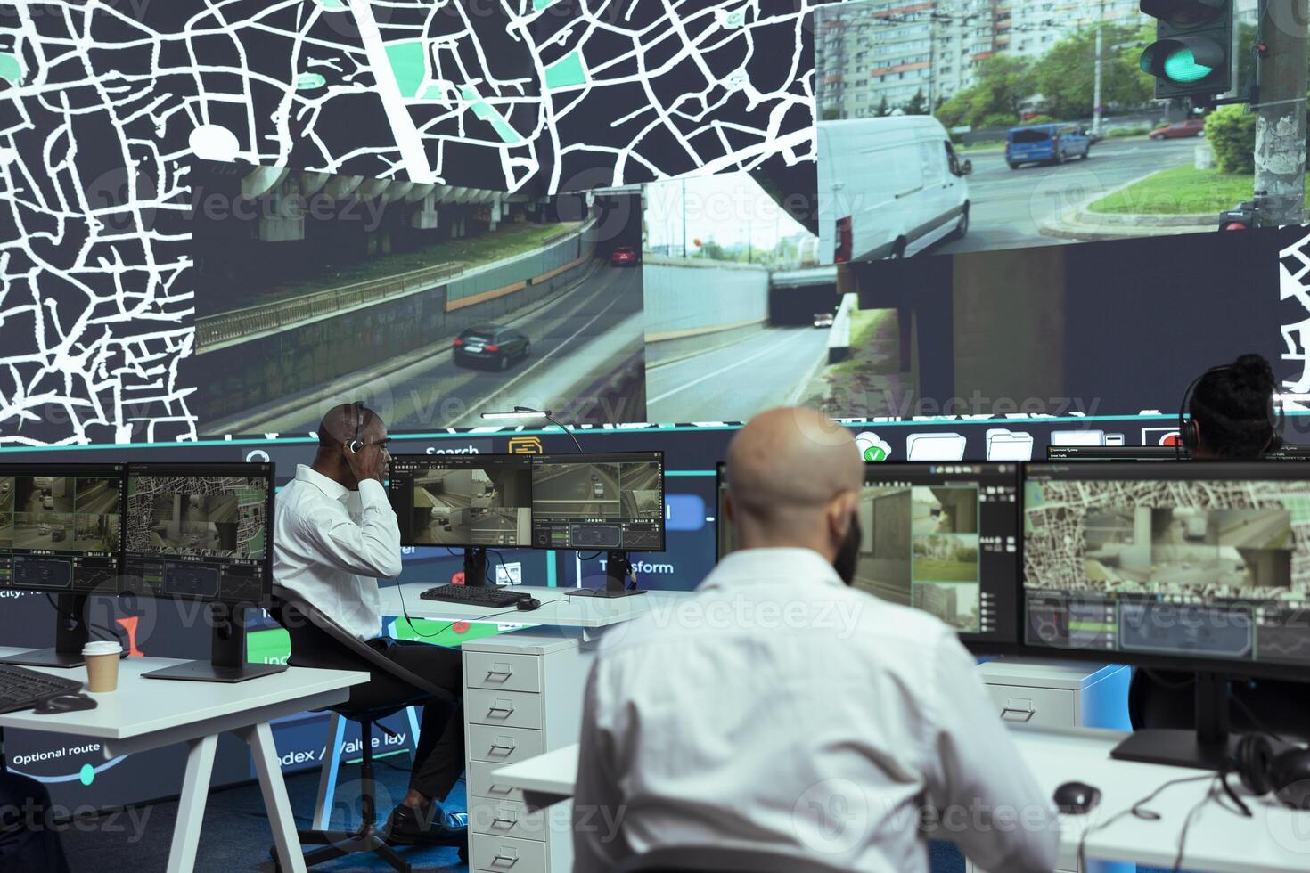 Diverse call center employees provides shipment updates to customers, handling order tracking service to combat shipment delay in control center. Agency guiding trucks on less busy routes. photo