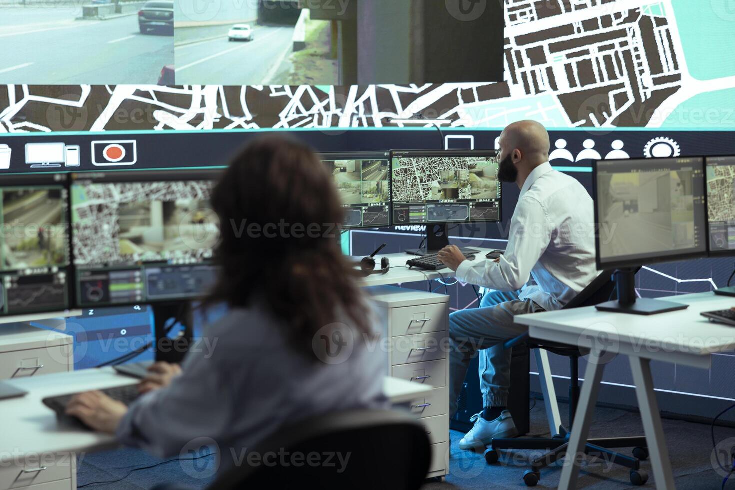 Diverse employees giving gps coordinates to couriers via satellite navigation, using city map to avoid traffic for express delivery service. Operators communicating routes for trucks. photo
